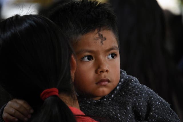 Catholic parishioners participate in the traditional Ash Wednesday ceremony at San Juan Sacatepequez's church, 30 kilometres northwest of Guatemala City on 6 March 2019