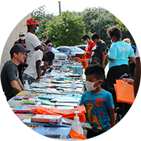 picture of free book fair with children picking up free books