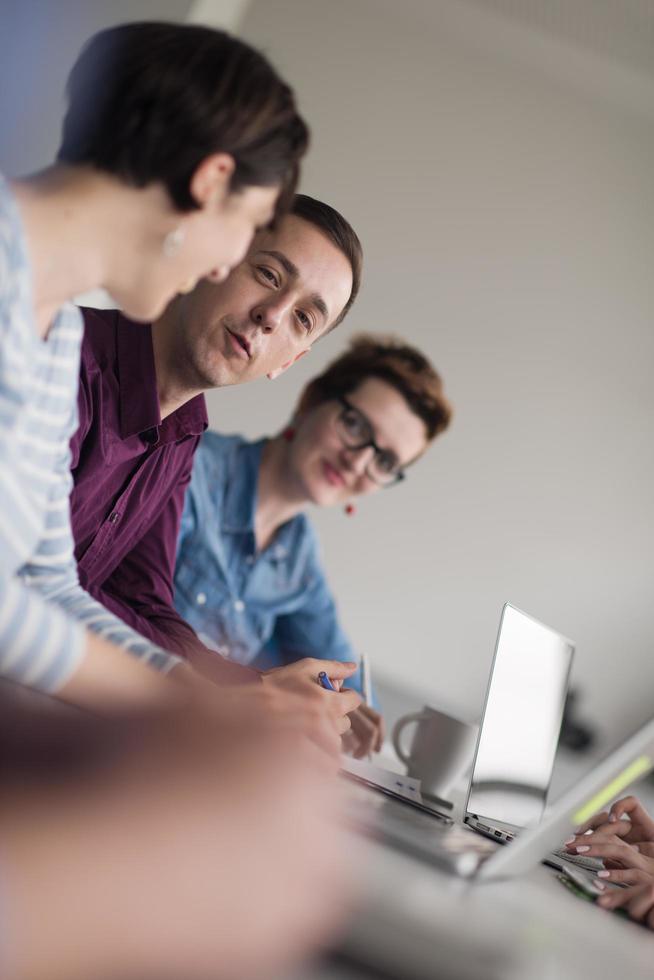 Group of young people meeting in startup office photo