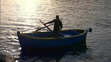 Man rowing a row boat video