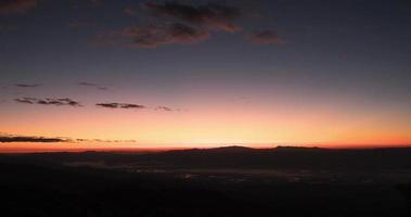 Time Lapse of foggy mountain with sunrise video