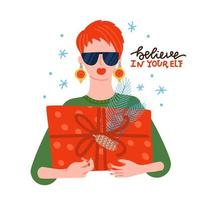 Cool young girl wearing sunglasses and baubles as earings with xmas gift box in hands. Festive holiday. Merry Christmas greeting card flat vector illustration with lettering - Believe in your elf.