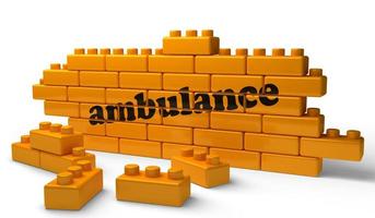 ambulance word on yellow brick wall photo