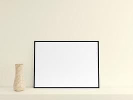 Customizable minimalist horizontal black poster or photo frame mockup on the podium table with vase. 3D Rendering.