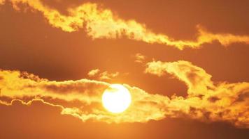 Timelapse of dramatic sunset with orange sky in a sunny day. video