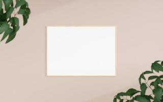 Clean and minimalist front view horizontal wooden photo or poster frame mockup hanging on the wall with blurry plant. 3d rendering.