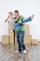 Young couple moving in new house photo