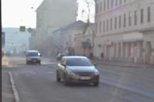 Blurred landscape of highway with cars in foggy morning photo