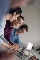 Group of young people meeting in startup office photo