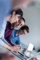 Group of young people meeting in startup office photo