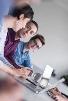 Group of young people meeting in startup office photo