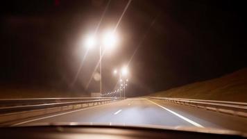 Inside View of the Windshield of a Car that is Driving Along the Evening Highway. POV Transport and Vehicle Concept. Traveling on the Road. No People. video