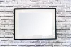 Blank picture frame hanging on wall photo