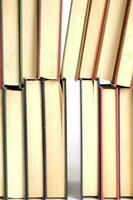 a stack of books on a white background photo