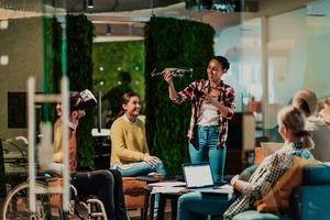 Business persons with a disability at work in modern open space coworking office on team meeting using virtual reality goggles. photo