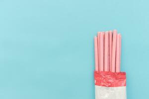 Pocky biscuits isolated on blue background. After some edits. photo