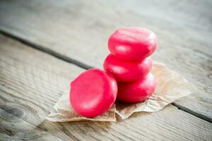 Stack of mini cheese on the wooden table photo