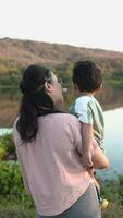 Mother and son travel, relax, outdoors in nature. video