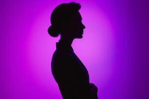 AI generated Silhouette of a middle-aged businesswoman against purple background photo