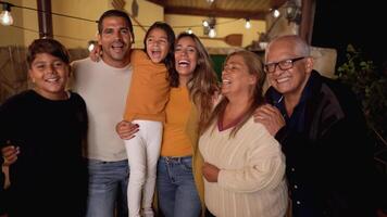 a family poses for a photo together video