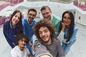 A team of medical experts and doctors captures a joyful moment, taking a selfie with a patient in a wheelchair, symbolizing inclusivity, support, and compassion in healthcare photo