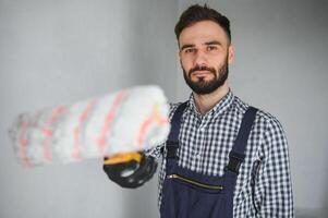 Young worker making repair in room photo