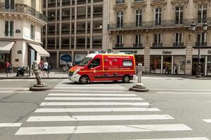 Paris, France 02 June 2018 An ambulance of classical red rides through the streets of Paris photo