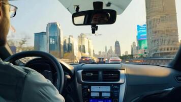 A taxi driver navigating through city streets, the background showing urban landmarks. video