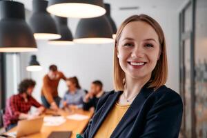 Confident Blonde Businesswoman Leading Team in Modern Office Setting. photo