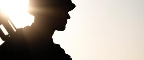 Silhouette of a Soldier Standing at Attention photo