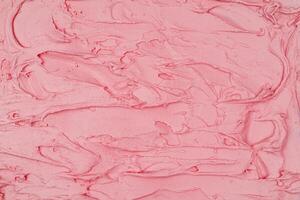 Strawberry ice cream texture. Top view. Delicious cool treat. photo