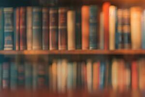 Soft blurred abstract library background with books, peaceful reading vibe. photo