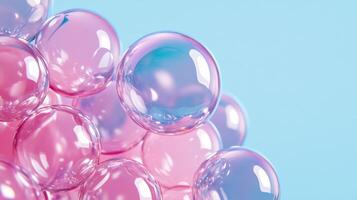 Glossy translucent paint bubbles in pastel shades floating over a pale gradient background photo