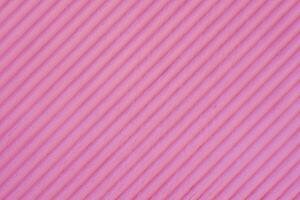 Diagonal pink plastered old wall. Abstract construction background. photo