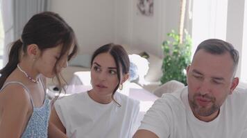 Family bonding over a fun activity at home during a sunny afternoon video