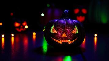 glowing carved pumpkin on a table photo