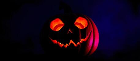 glowing carved pumpkin with a menacing grin photo