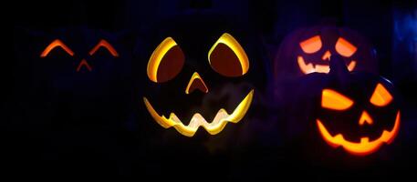 luminous jack-o'-lanterns create a spooky halloween atmosphere photo