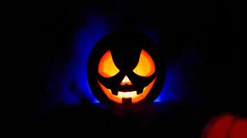 glowing carved pumpkin with a menacing grin photo