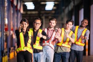 Portrait of group employees in the warehouse with thumb up photo