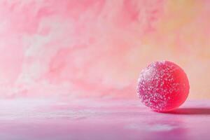 Pink Sugary Candy Sphere On Pink Background photo