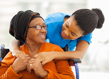African American Caregiver Assisting Senior Client in Wheelchair - Compassionate In-Home Care Services