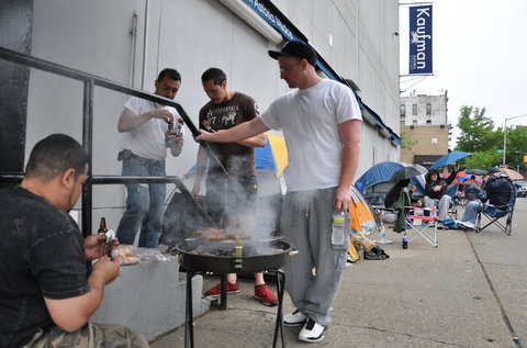 Hundreds of men waited in line in Queens for as long as five days for a chance at a union elevator-mechanic job. From left, Edwin DeLeon, Andres Loaiza, Carlos Ramirez and Gerry Dubatowka turned the wait into a cookout.