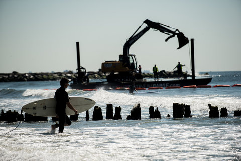 The city is removing the old wooden groins from Beach 87th to Beach 91st in Rockaway, citing their danger to surfers.