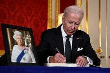 President Biden signing the official condolence book for Queen Elizabeth II at Lancaster House in London on Sunday.