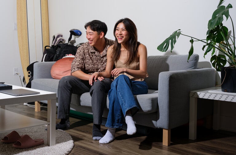 Caroline Li and Colin Wang are among the many young couples who are choosing to move in together early in their relationships to save money on housing and living costs.