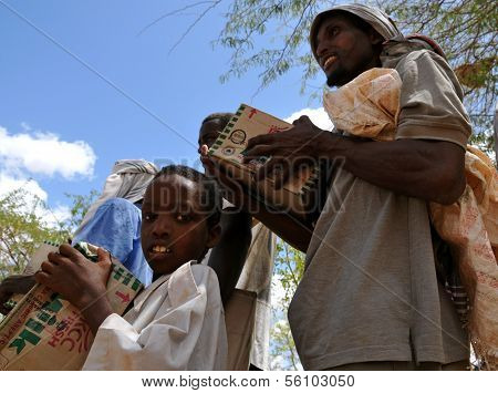 African Father And Son Were Receiving Assistance