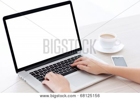 Female Hands Typing On A Laptop Keyboard With Isolated Screen In A White Room