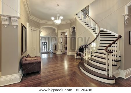 Foyer With Curved Staircase