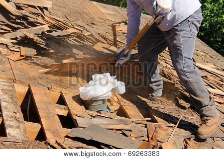 Demolition and removal of an Old Asphalt Single roof that was installed over an old Cedar Shake Roof from the 1960's era. Roofs generally last about 20 years before needing to be replaced. 